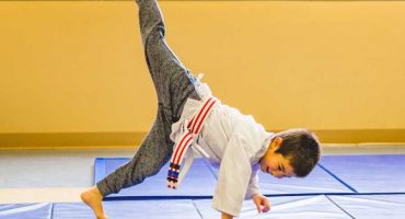 Student Joyfully Practicing Capoeira Brazilian Martial Art Form During School Break Camp