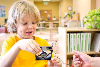 Elementary School Aged Camper Building A Bluetooth Speaker In Mad Scientists & Inventors